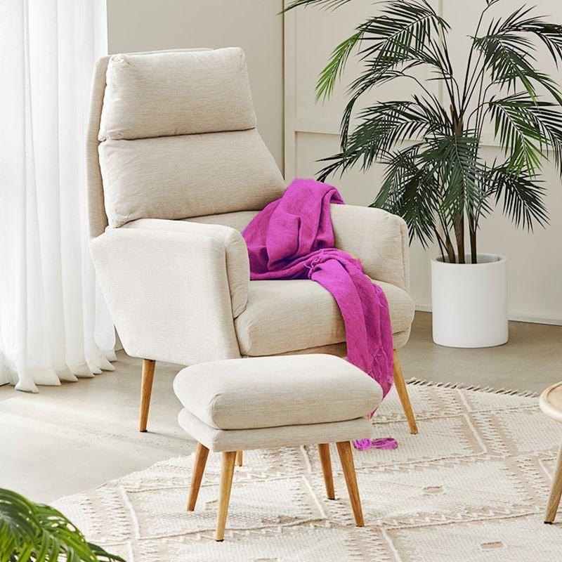 Armchair with a draped throw in a calm therapy space